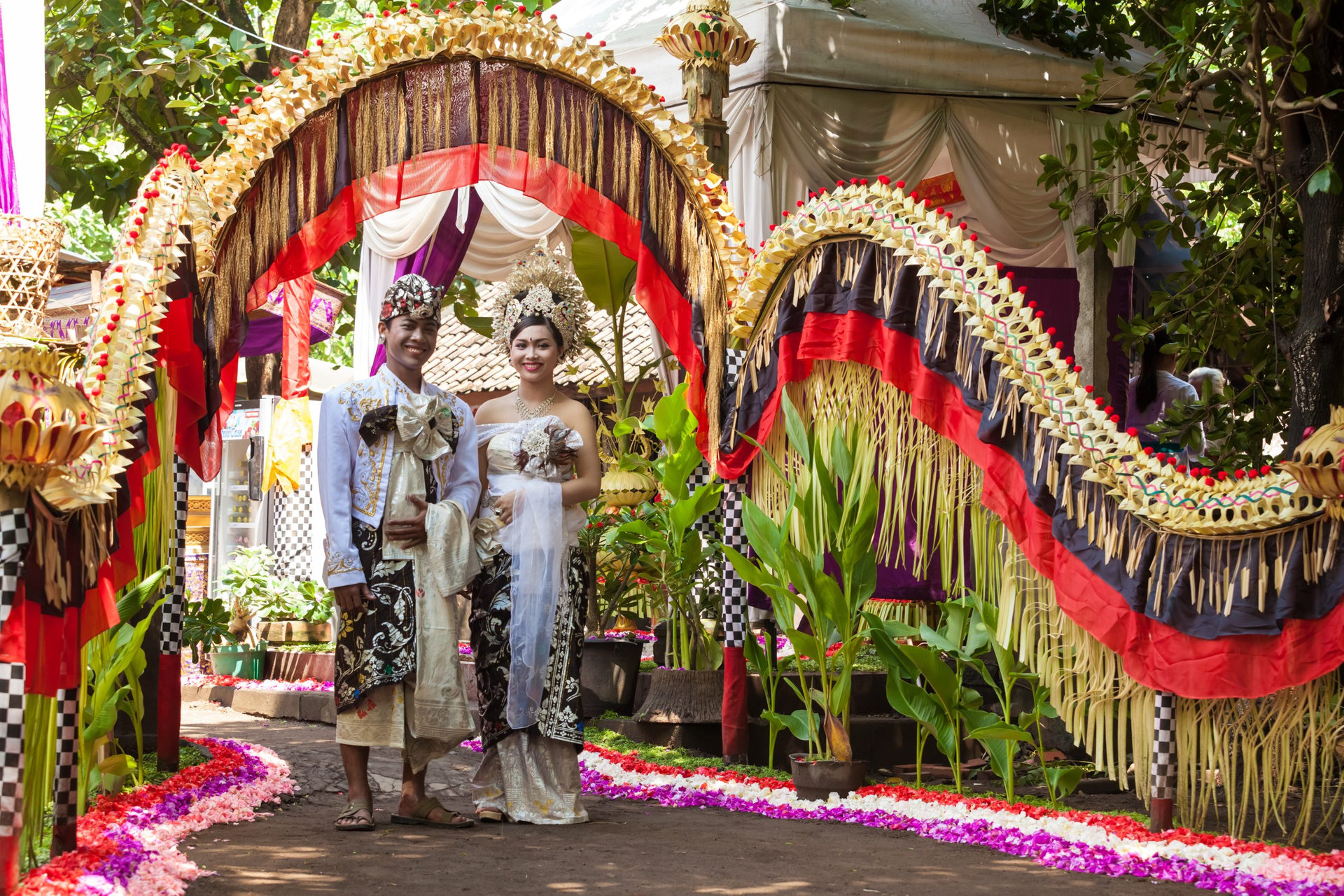 BALI - FEBRUARY 11. Couple enacting wedding scene in preparation for religious ceremony on February 11, 2012 in Bali, Indonesia. Most Balinese get married in their early 20s.