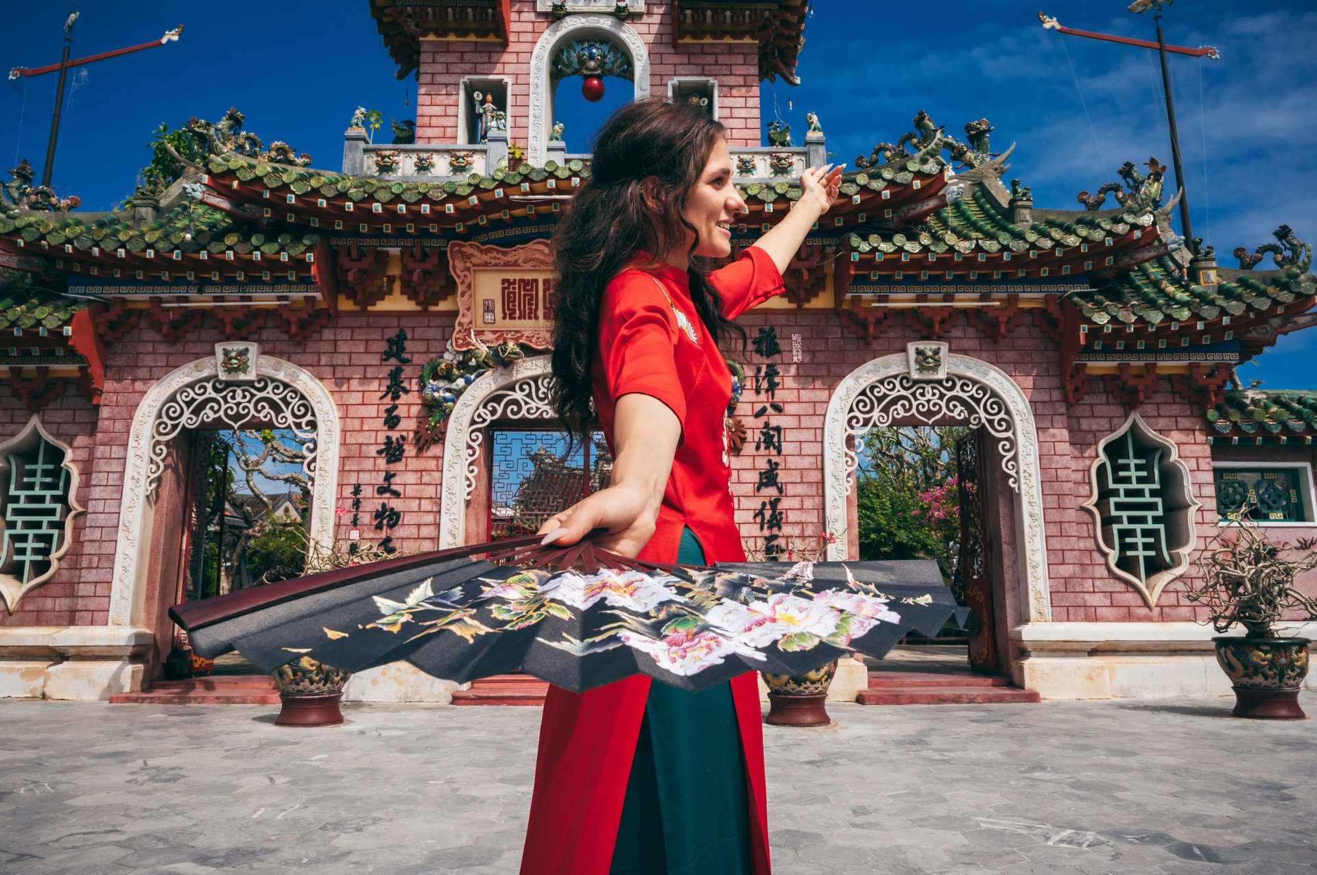 Tourist walking at Fukian Assembly Hall in the Hoi An ancient town, Vietnam.