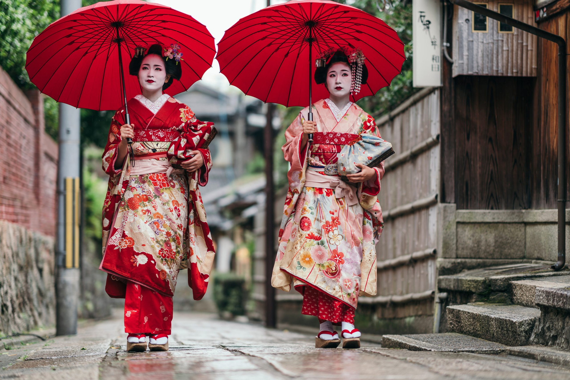 Maiko geisha walking on a street of Gion in Kyoto Japan