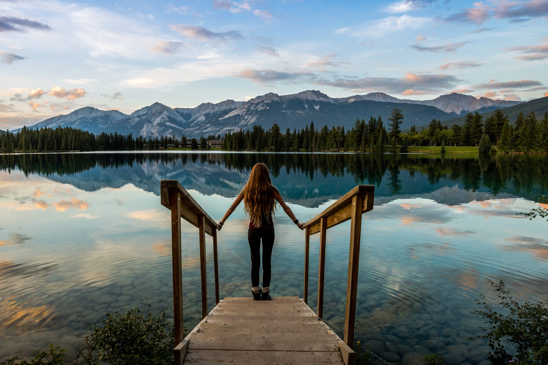 girl stand on stairs enjoying the sunset, jasper national park