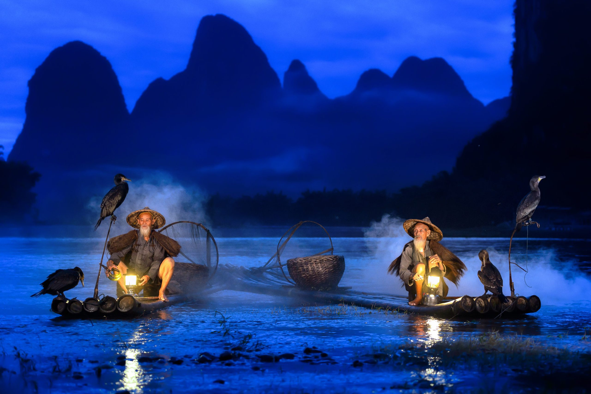 Fisherman of Guilin, Li River and Karst mountains during the blue hour of dawn,Guangxi China