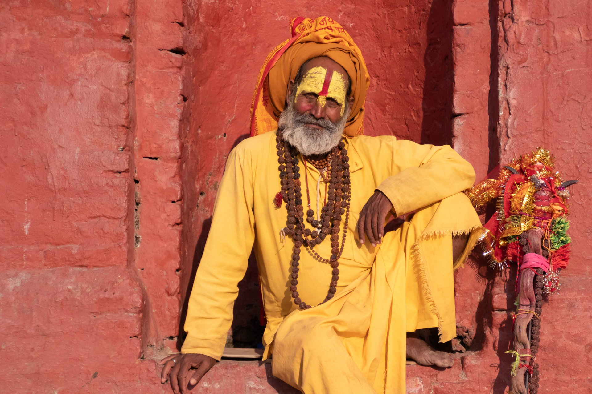 Kathmandu Sadhu men holy person in hinduism with traditional painted face at Pashupatinath Temple of Kathmandu - Non English word in image is prayer words
