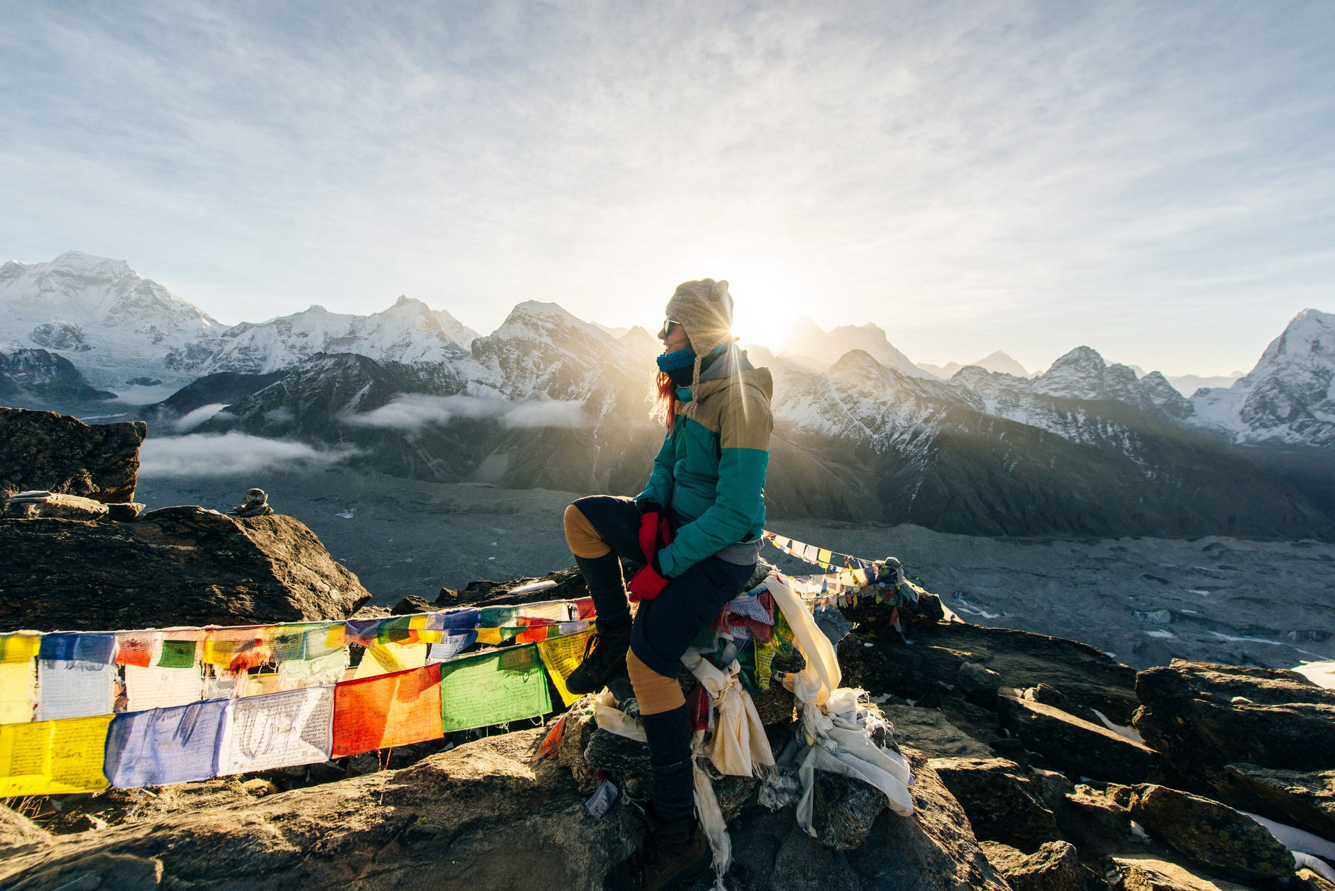 Female Tourist Hikking at gokyo ri mountain peak near gokyo lake during Everest base camp trekking