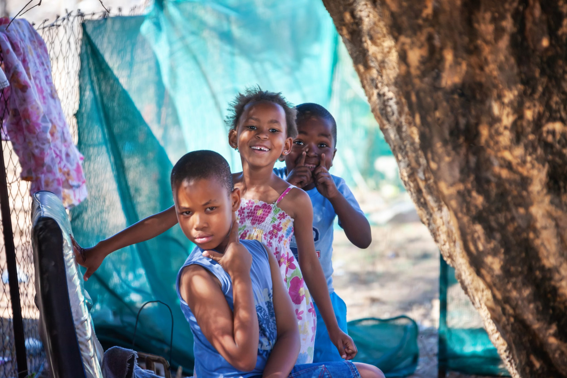 Daily African life in an a village in the rural Botswana , kids playing in the yard