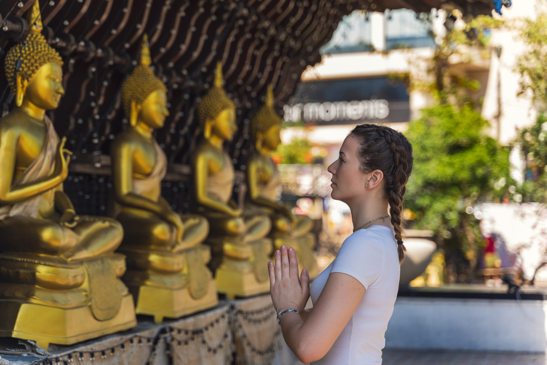young woman visiting a temple in Colombo, Sri Lankaman visiting a temple in Colombo, Sri Lanka