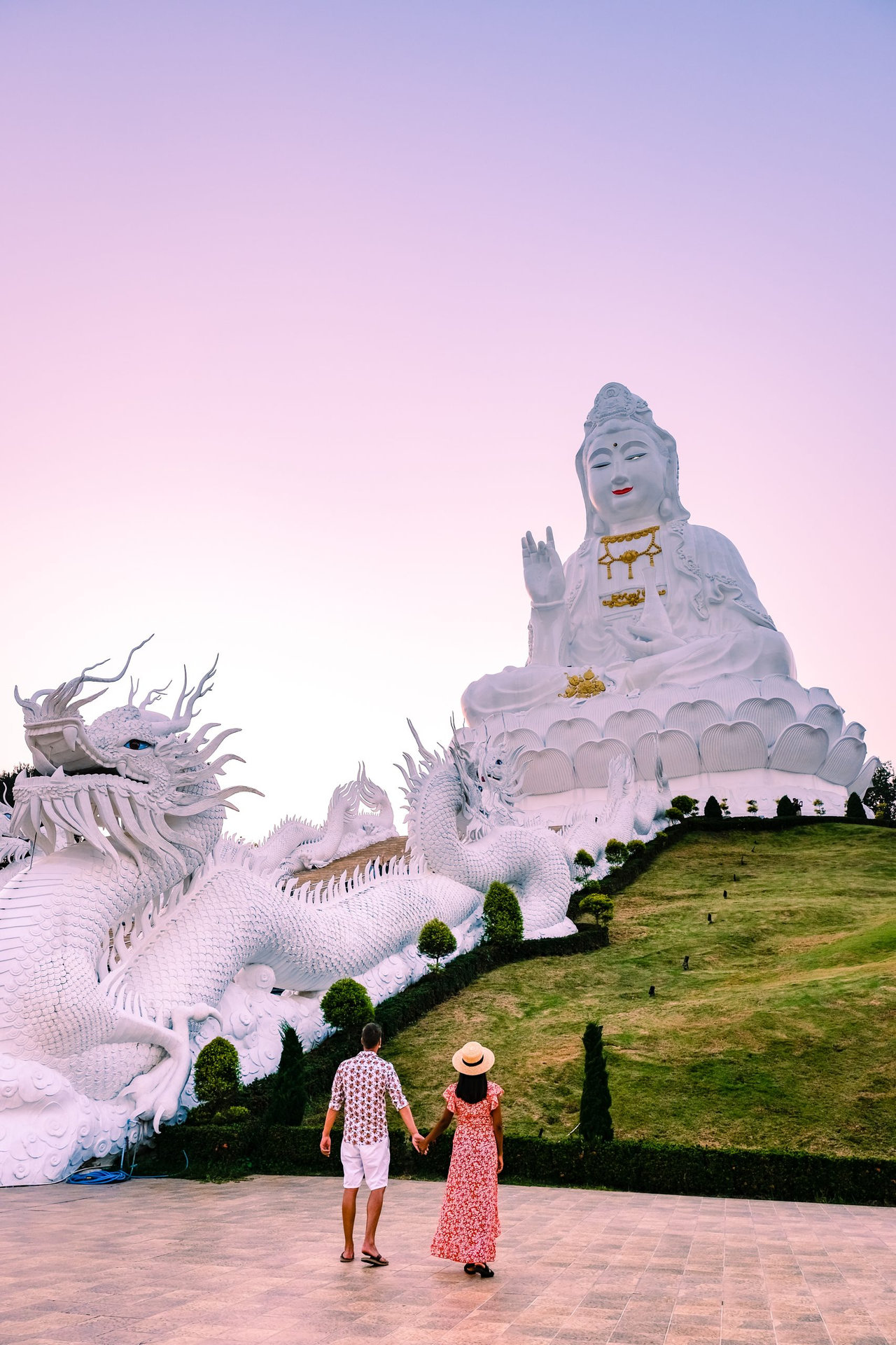 Wat Huay Pla Kung Chiang Rai Thailand during sunset. Wat Huay Pla Kung or Big Buddha Temple in Chiang Rai province North of Thailand, During sunset at dusk, The temple, couple man woman visit temple