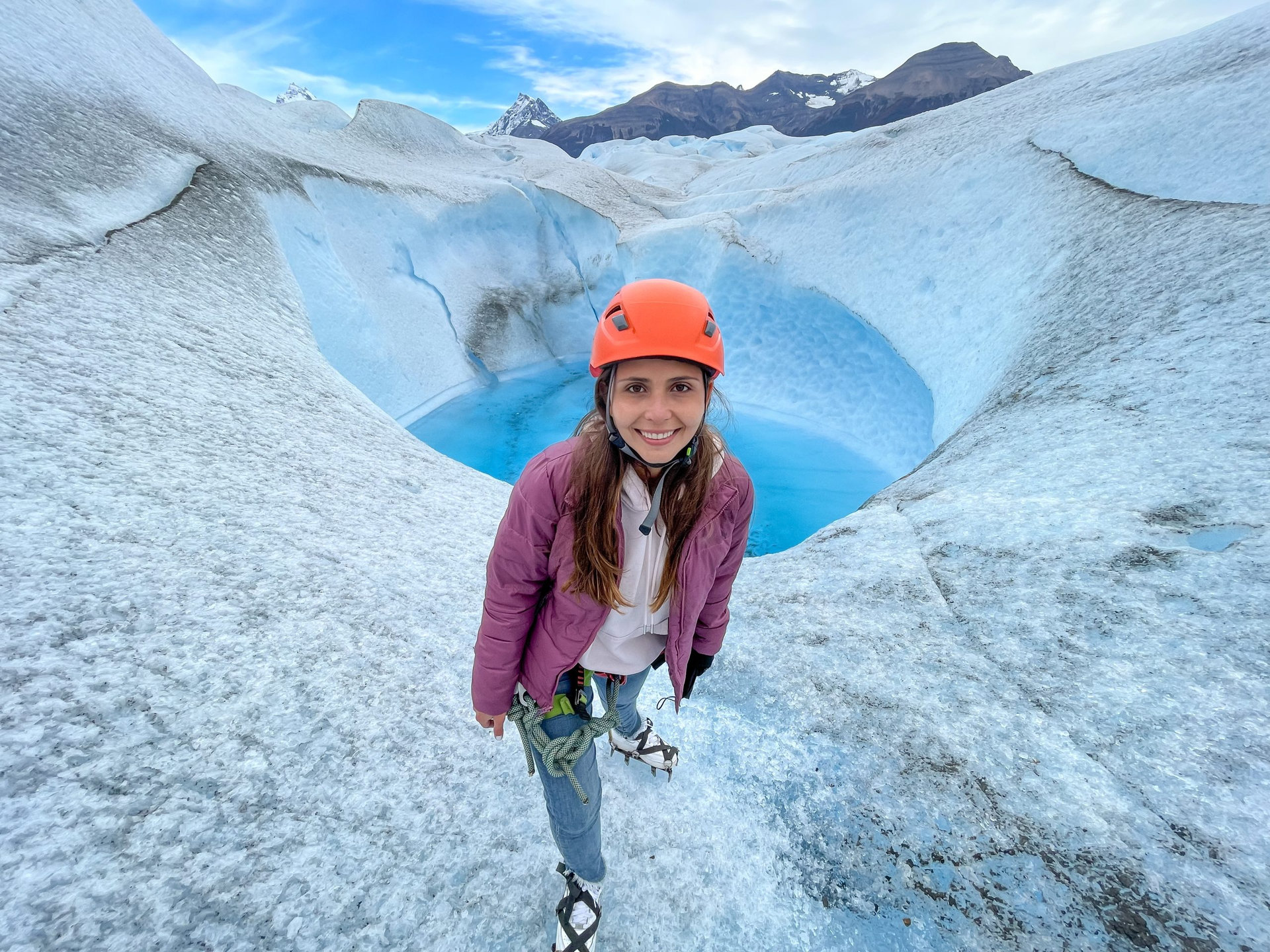 Female traveler posing at the Perito Moreno Glacier in El Calafate, Argentina, Patagonia, South America