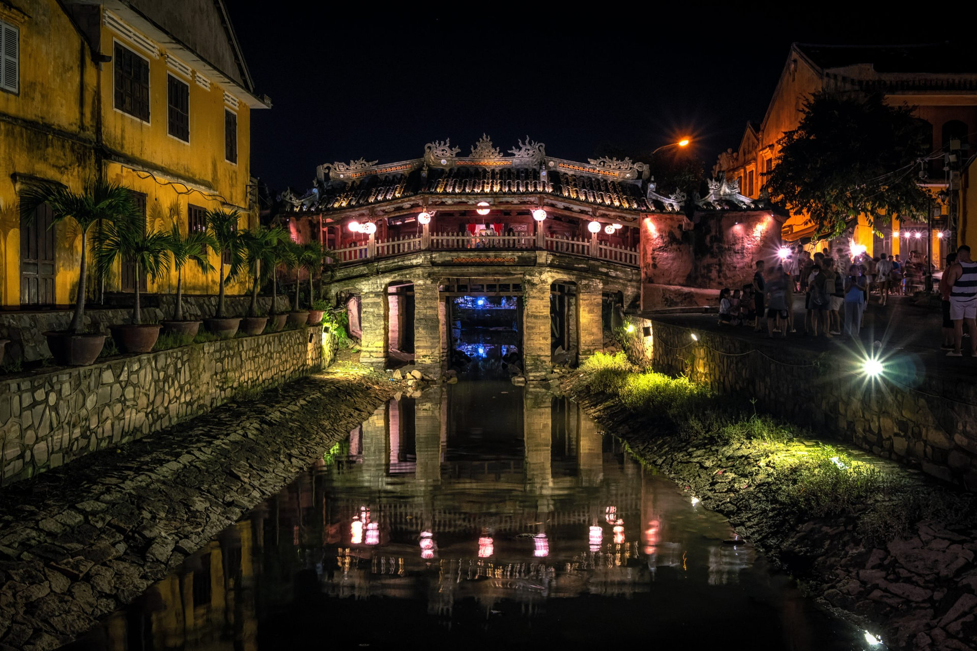 Japanese covered bridge lit up taken at night. Famous Bridge also called Cau Temple is a landmark in Hoi An Ancient Town, Vietnam.