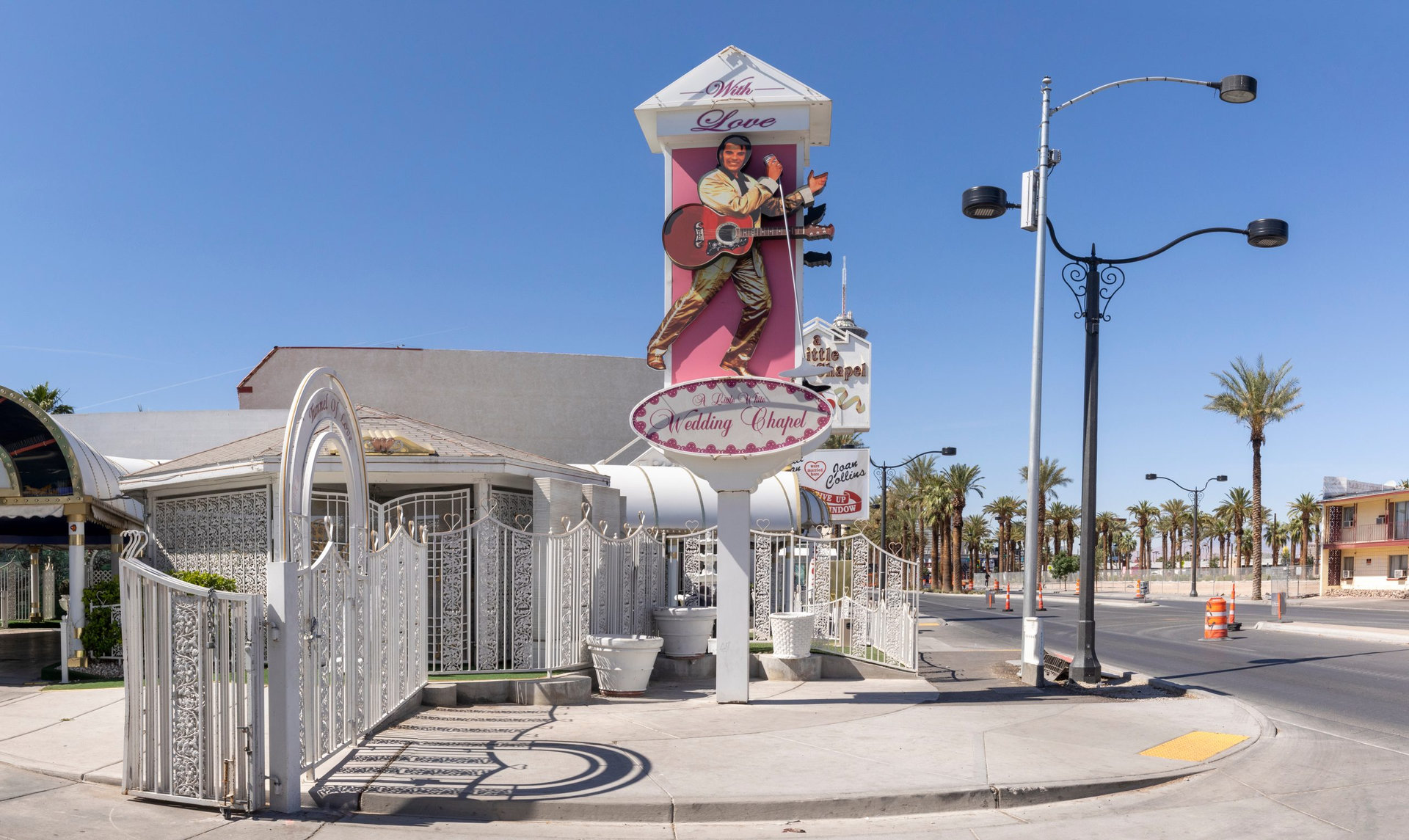 Las Vegas, USA - May 24, 2022: sign wedding chapel with picture of Elvis Presley and the little white chapel in background for fast marriages.
