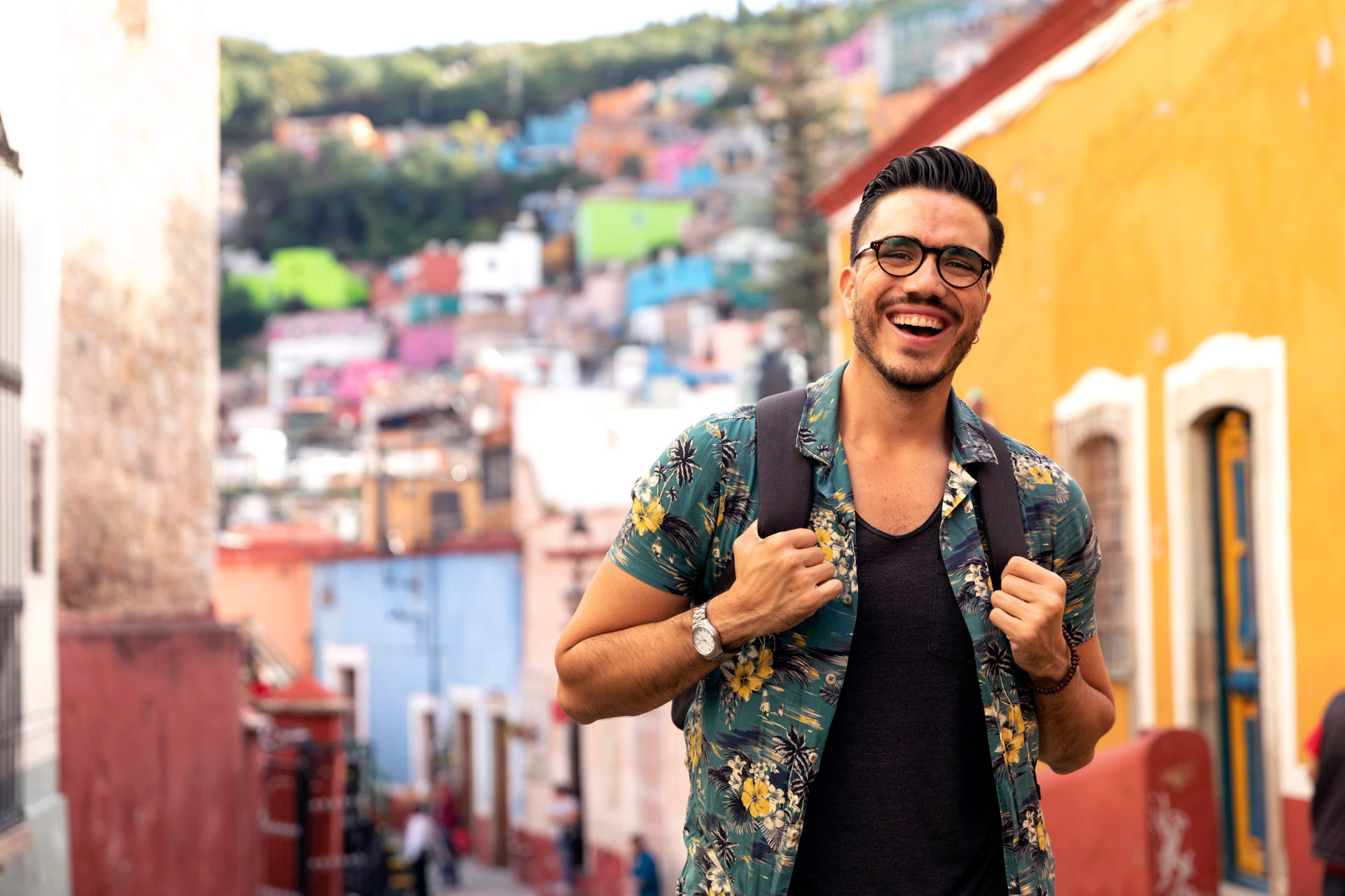 Mexican man visiting colorful Guanajuato historic center.