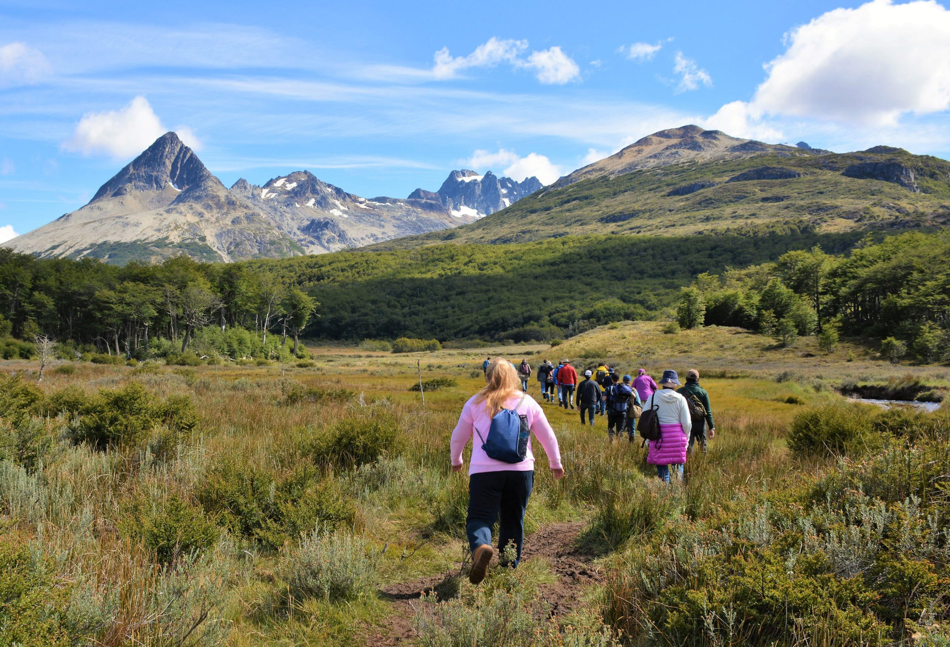 A group of tourists hike through the peat bogs of Tierra Del Fuego National Park at the southern tip of South America