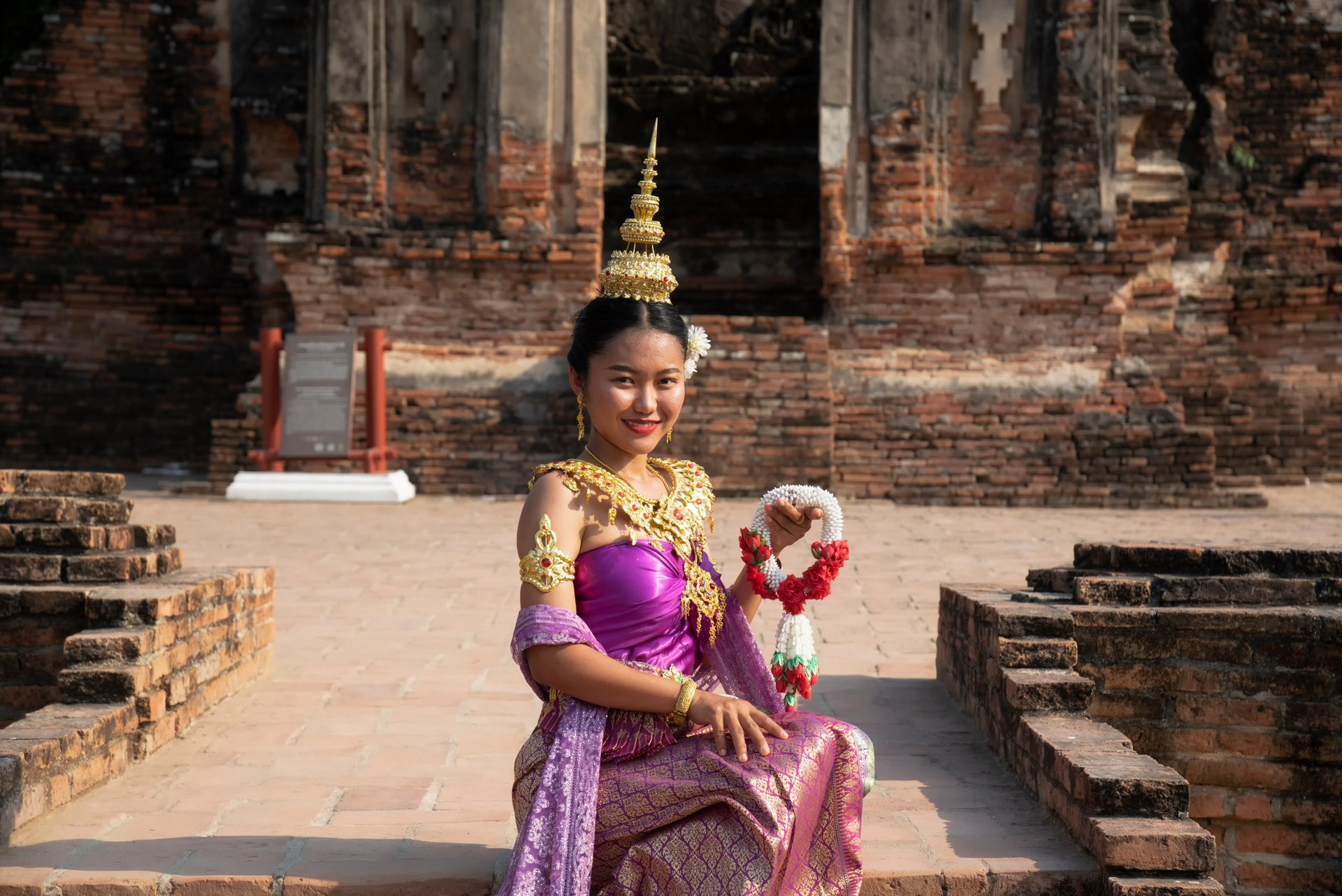Beautiful Thai girl in Asian tourists is visiting at Sukhothai in Thailand.