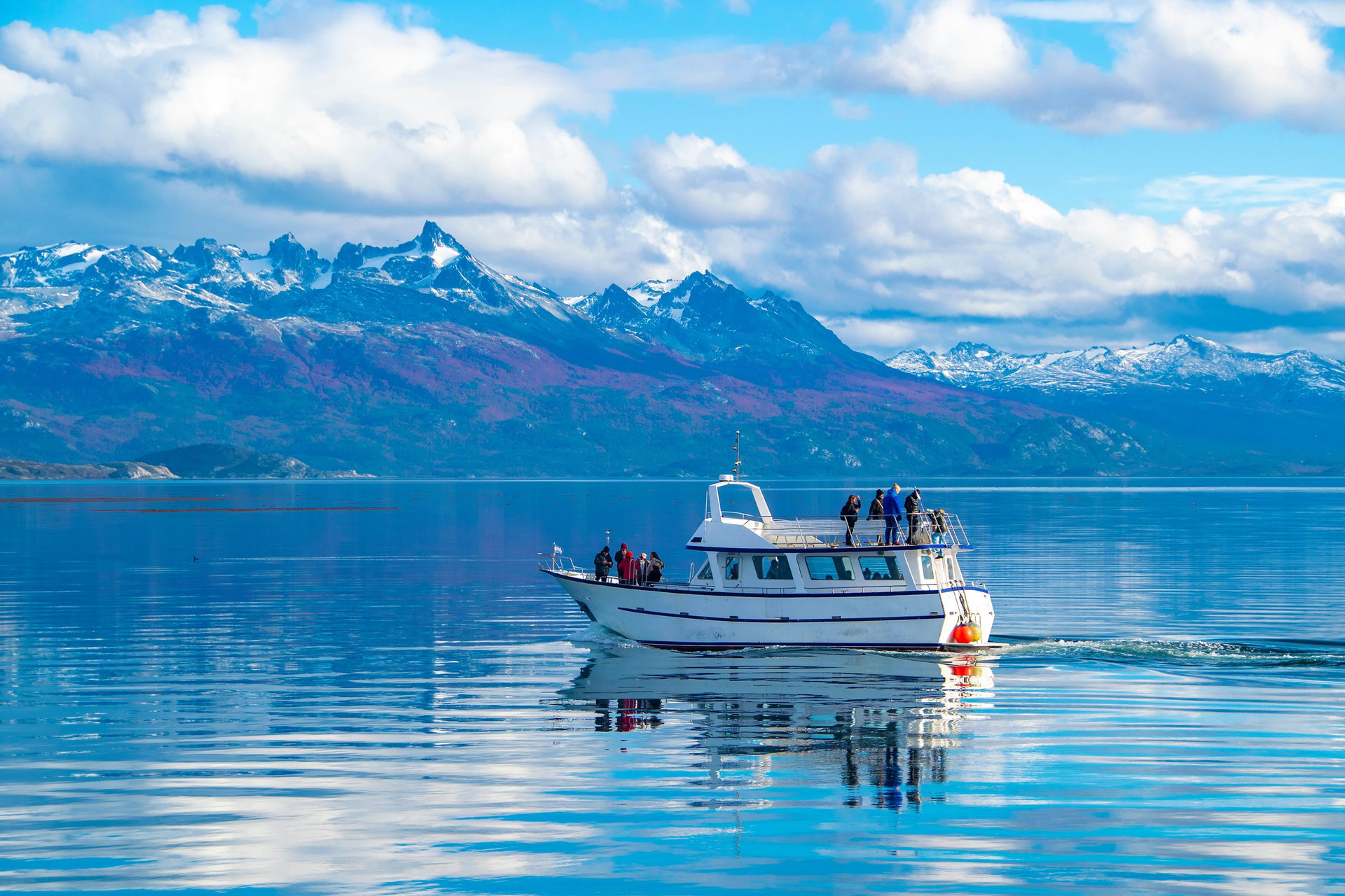 Tourist trip excursion ship sailing at beagle channel, ushuaia, tierra del fuego, argentina