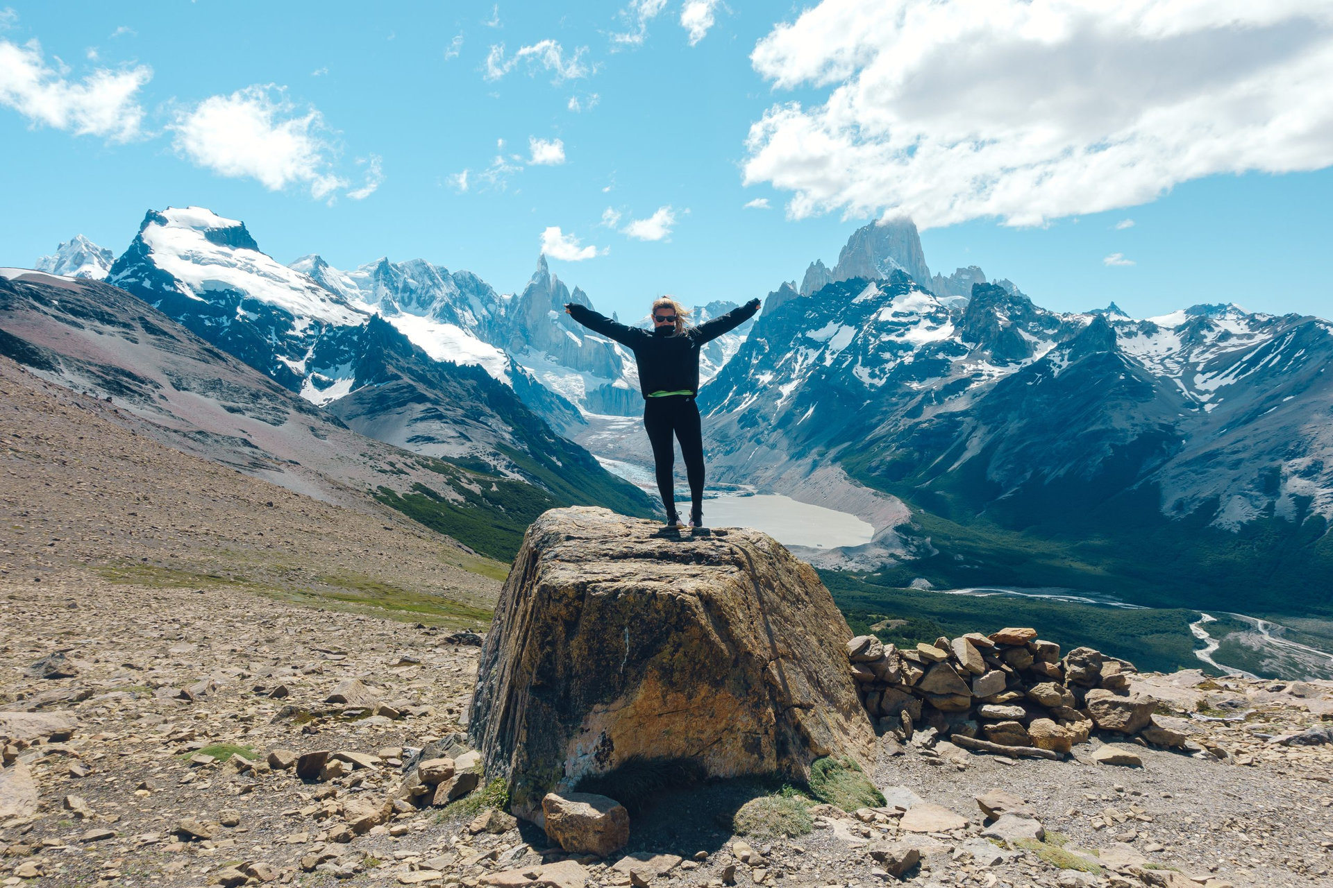 woman poses in beautiful view towards Cerro Torre