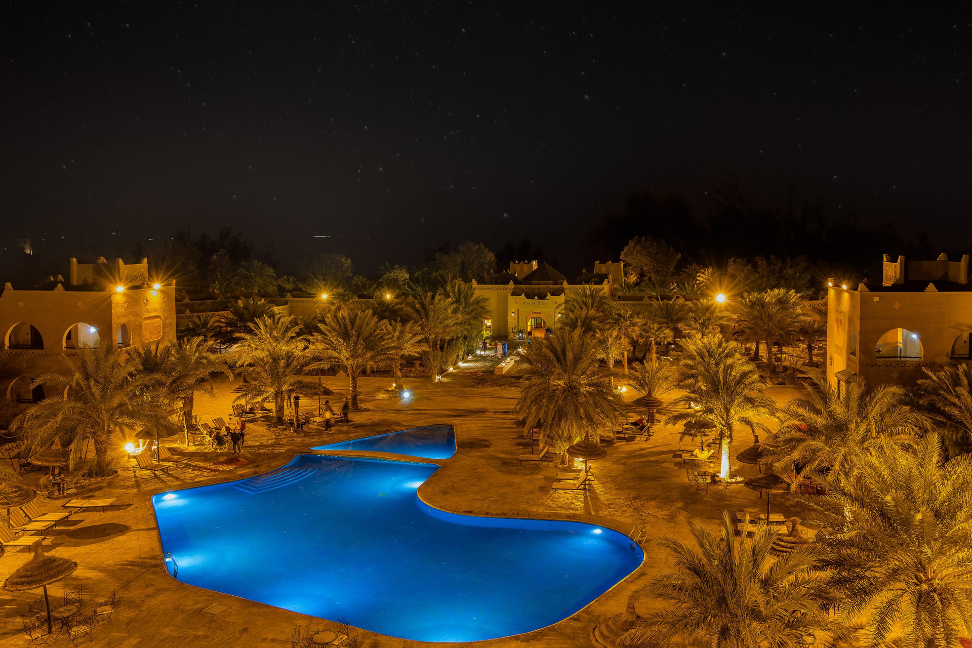 Kasbah-Hotel Chergui. Pool and garden of a maroccan kasbah hotel at night, Maroc, Africa.