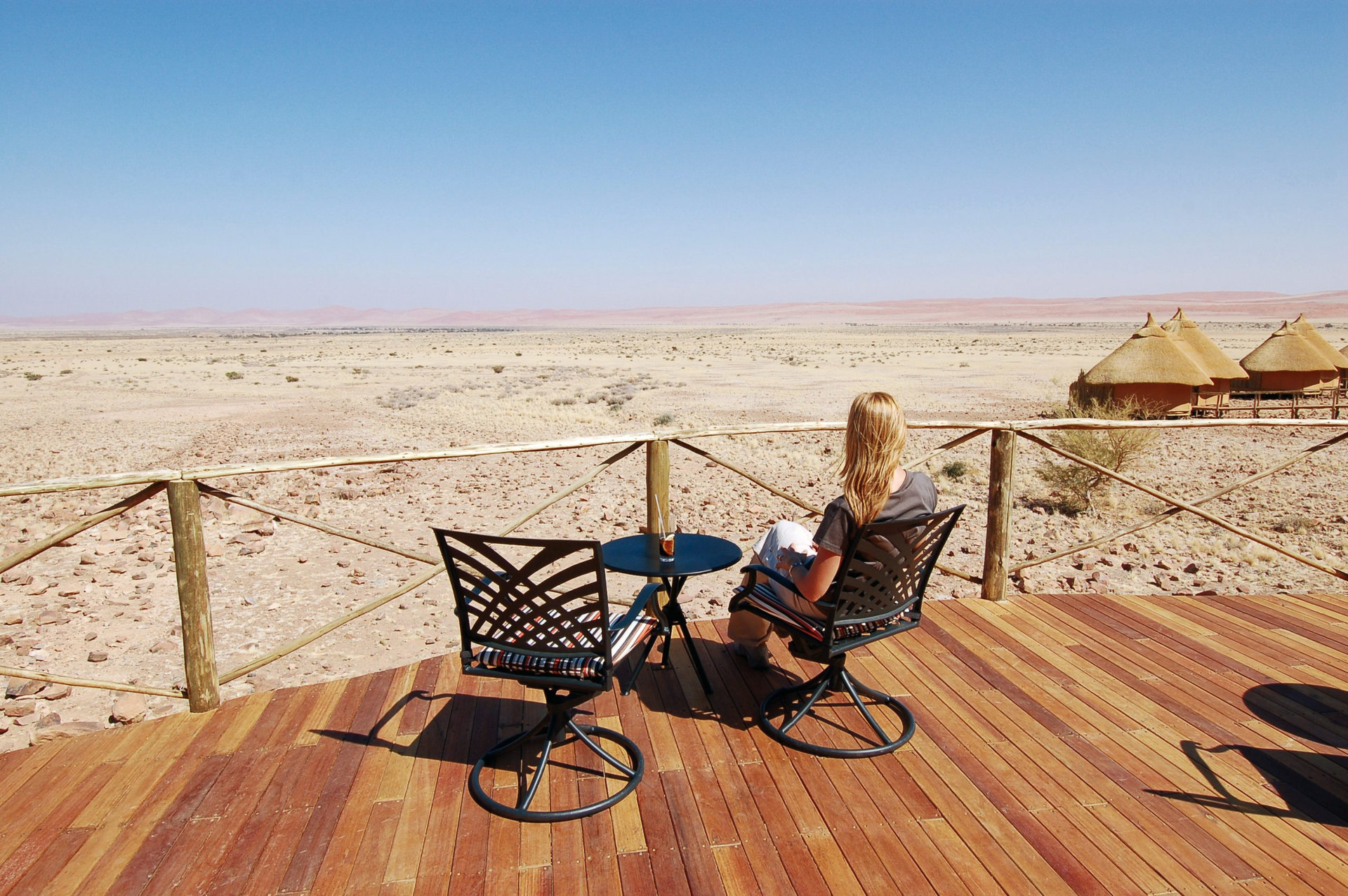 Woman look at the desert - Desert background. Namibia, Deadvlei, Sossuvlei.