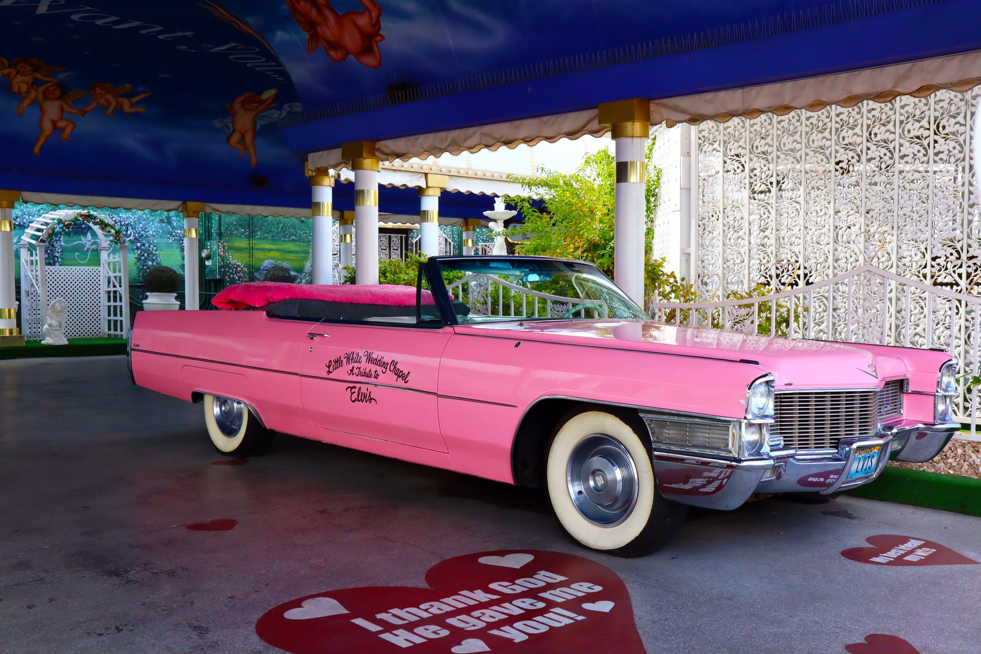 Las Vegas, Nevada – December 7, 2023: Elvis Pink Cadillac wedding car at Little White Wedding Chapel world famous church to get married located at 1301 S Las Vegas Blvd, Las Vegas, NV