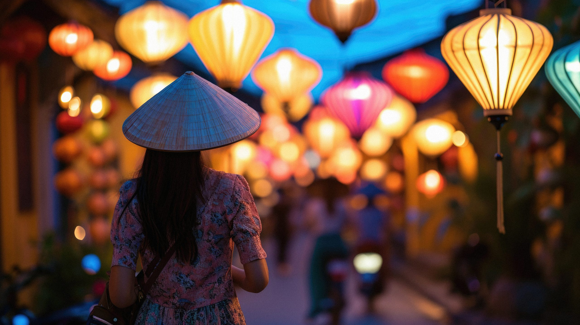 Asian woman traveler in traditional Vietnamese hat walking in Hoi An, Vietnam.