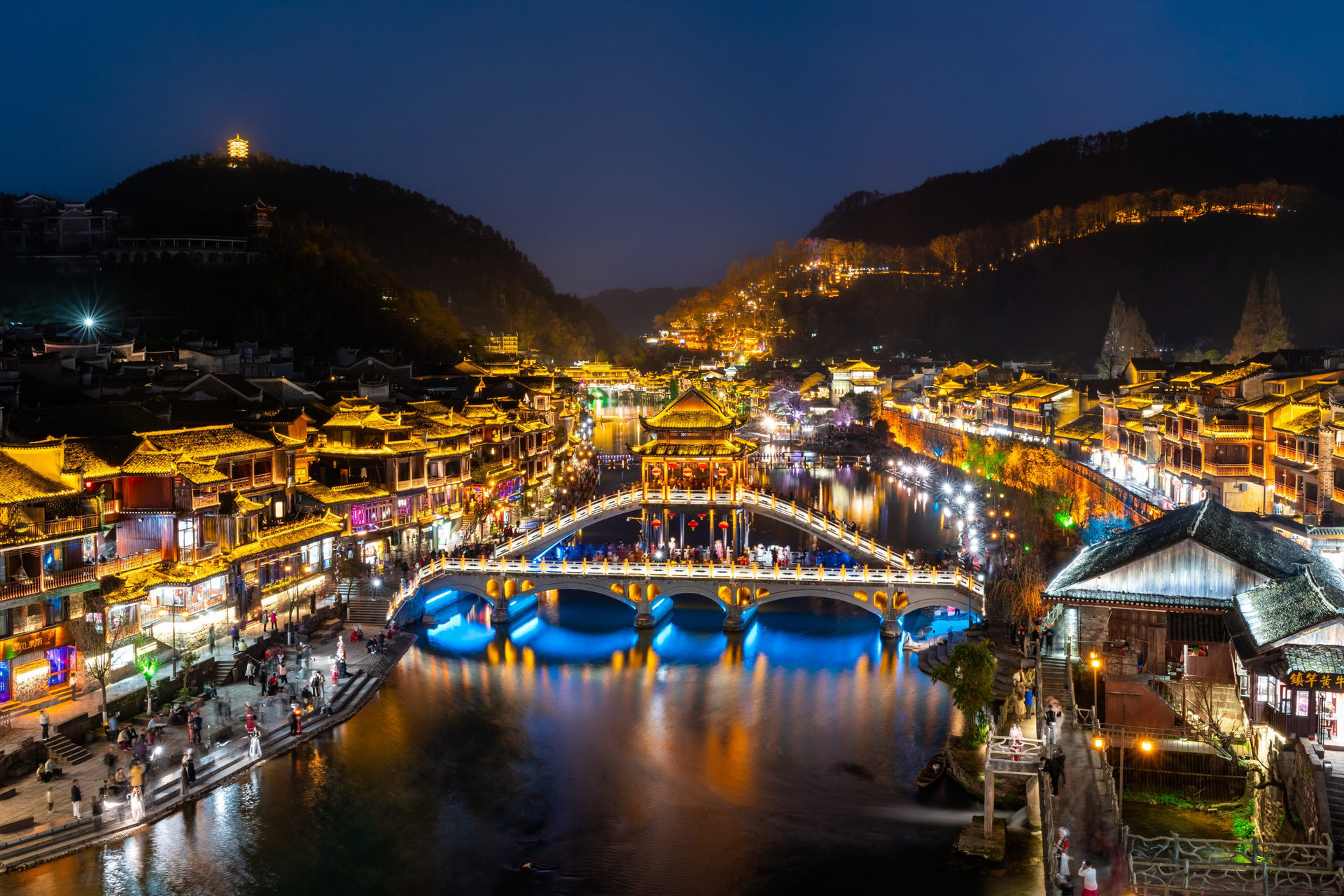Feng Huang Ancient Town (Phoenix Ancient Town) and tourist boats on Tuo Jiang River, The famous tourist destination at Hunan Province, China