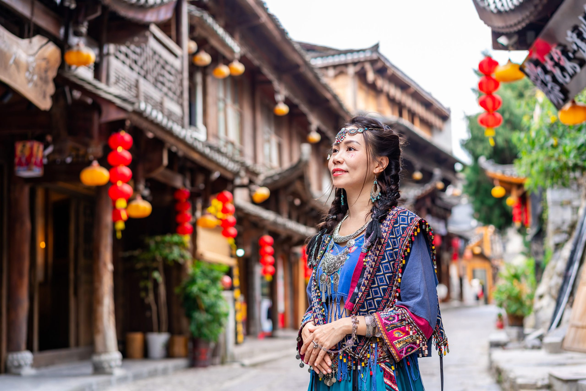 Young female tourist in traditional dress walking at Furong old Town, The famous tourist destination at Hunan Province, China
