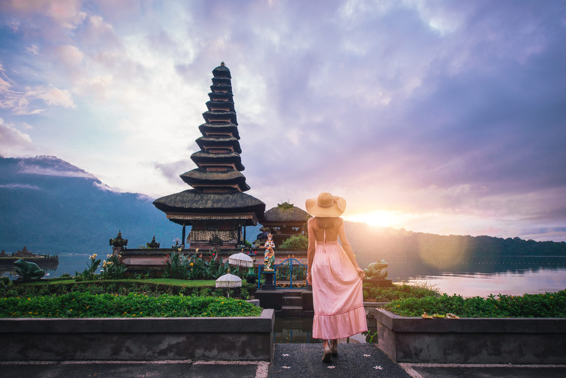 Beautiful girl visiting the ulun danu bratan temple in Bali. Concept about exotic lifestyle wanderlust traveling