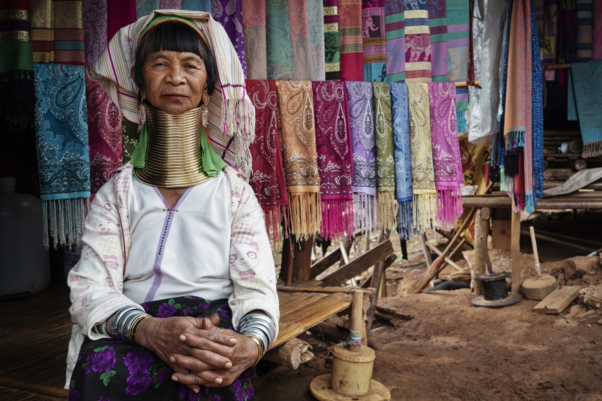 Chiang Rai Province, Thailand, Karen Long Neck woman wearing traditional brass rings in hill tribe village near Chiang Rai.